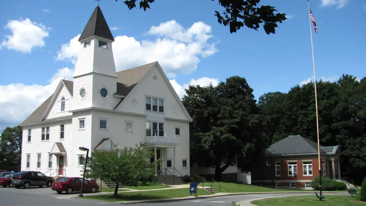 Auburn Town Offices and Merriam Library, a white clapboard civic building with a steepled tower, Auburn, Massachusetts
