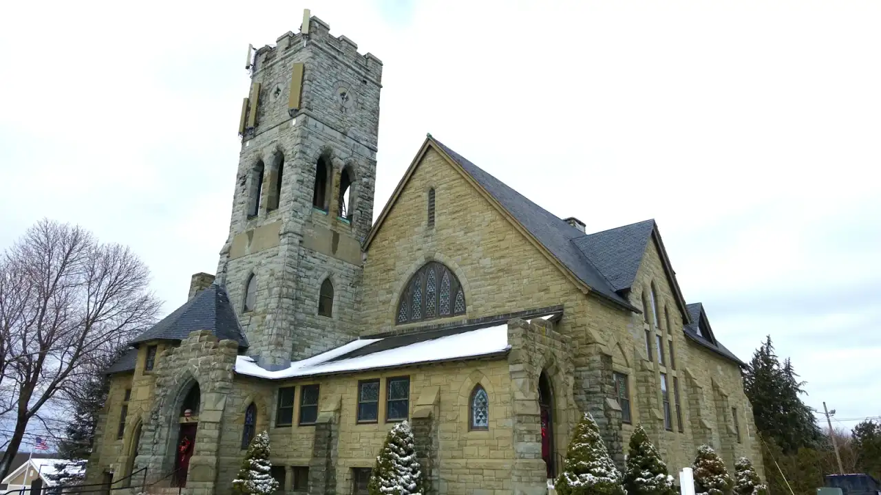 First Congregational Church, a Romanesque stone church with a crenellated tower, Leicester, Massachusetts