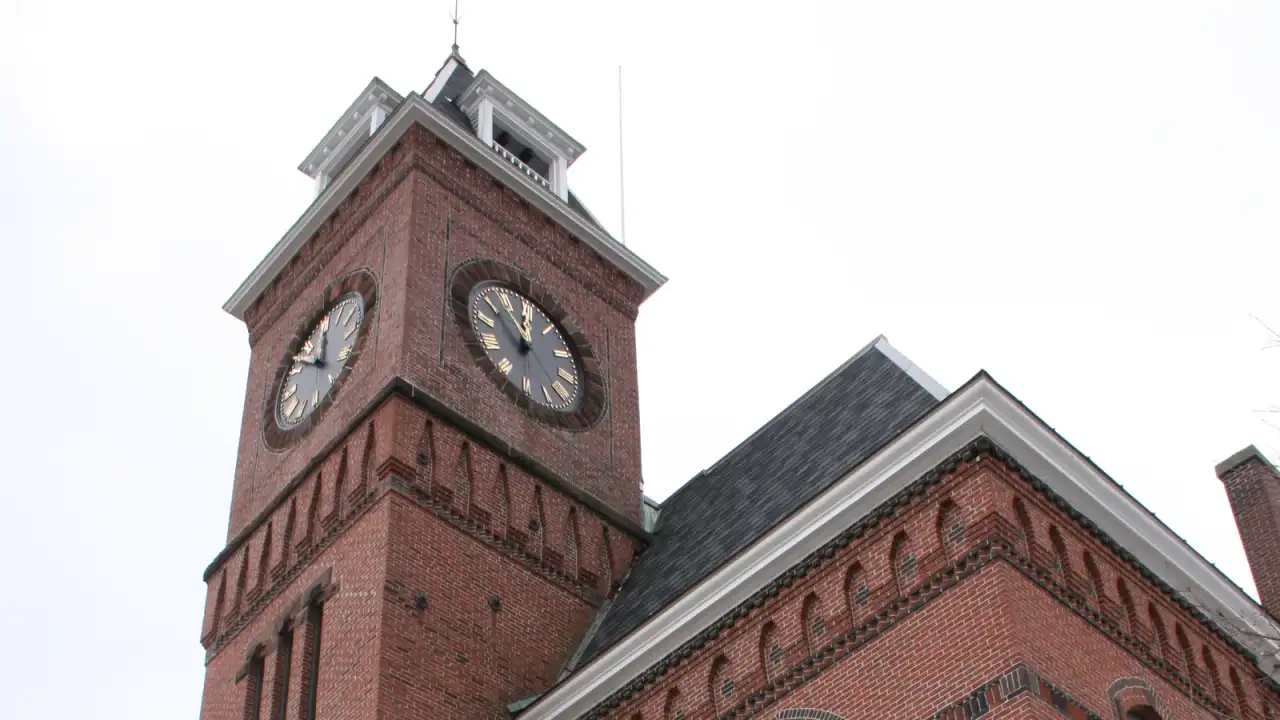 Oxford Town Hall, a Romanesque brick memorial building with a clock tower, Oxford, Massachusetts